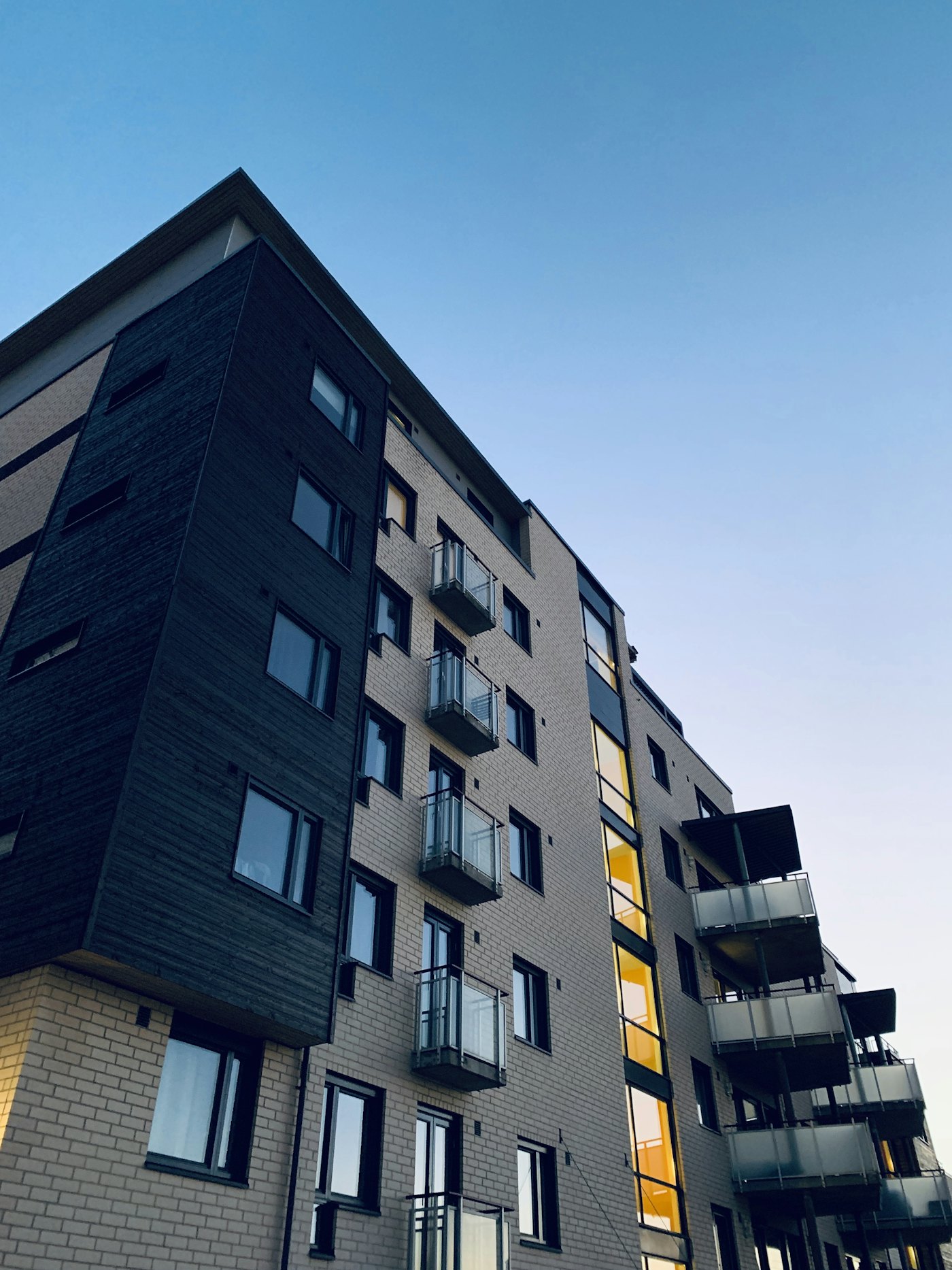 A residential building with lit homes